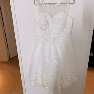 Used. Unique vintage wedding dress